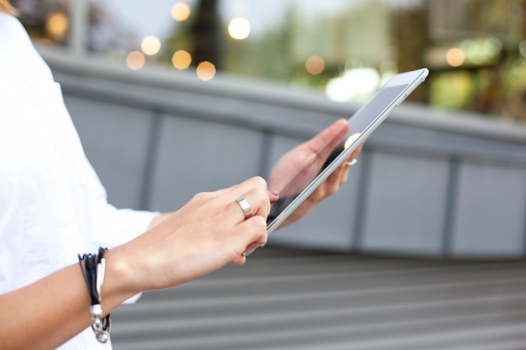 Woman with ipad using administration software