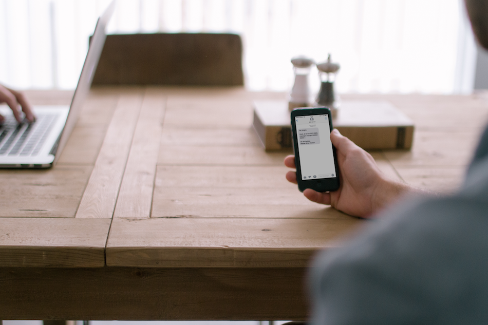 a person reading an SMS