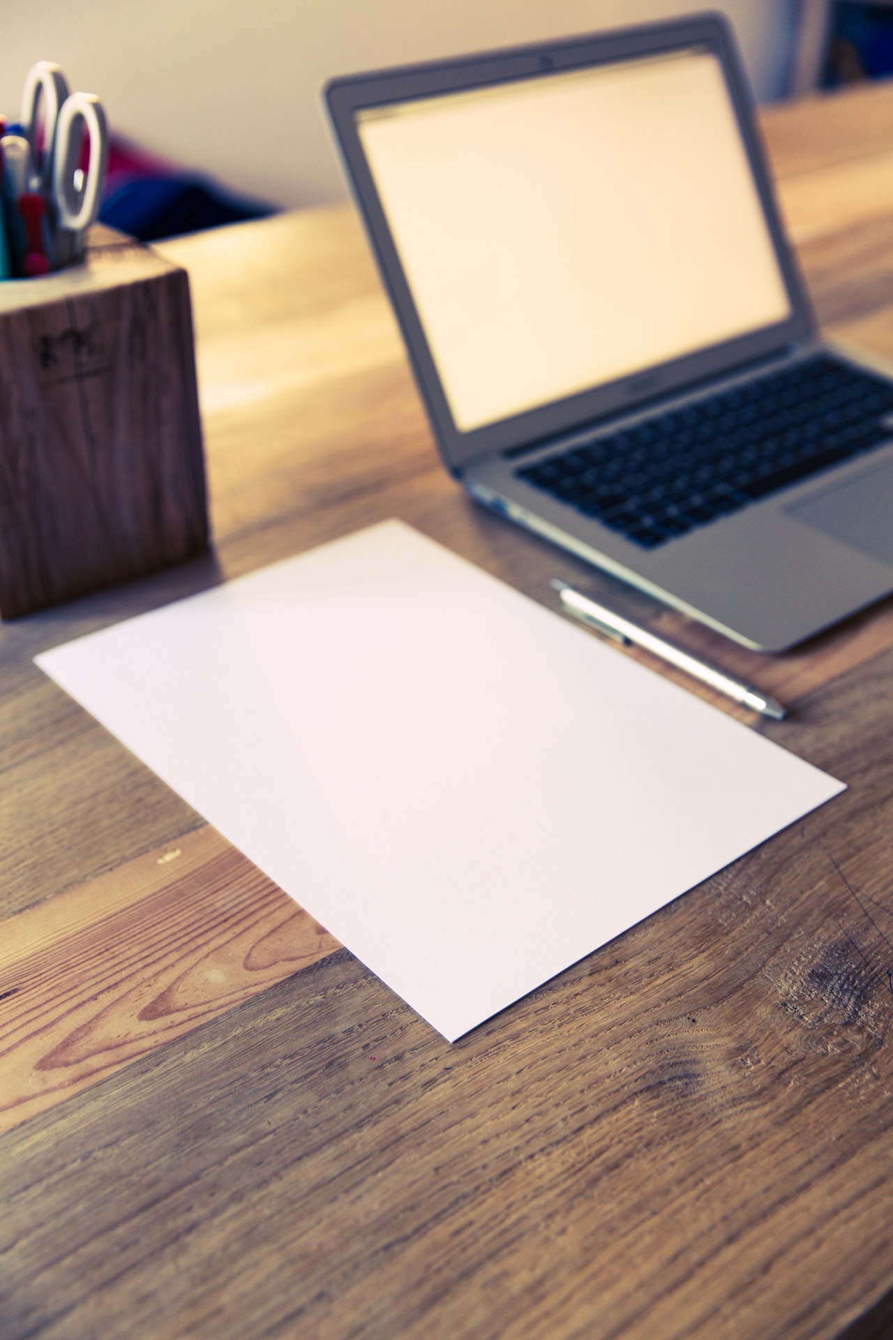 Computer and paper on table