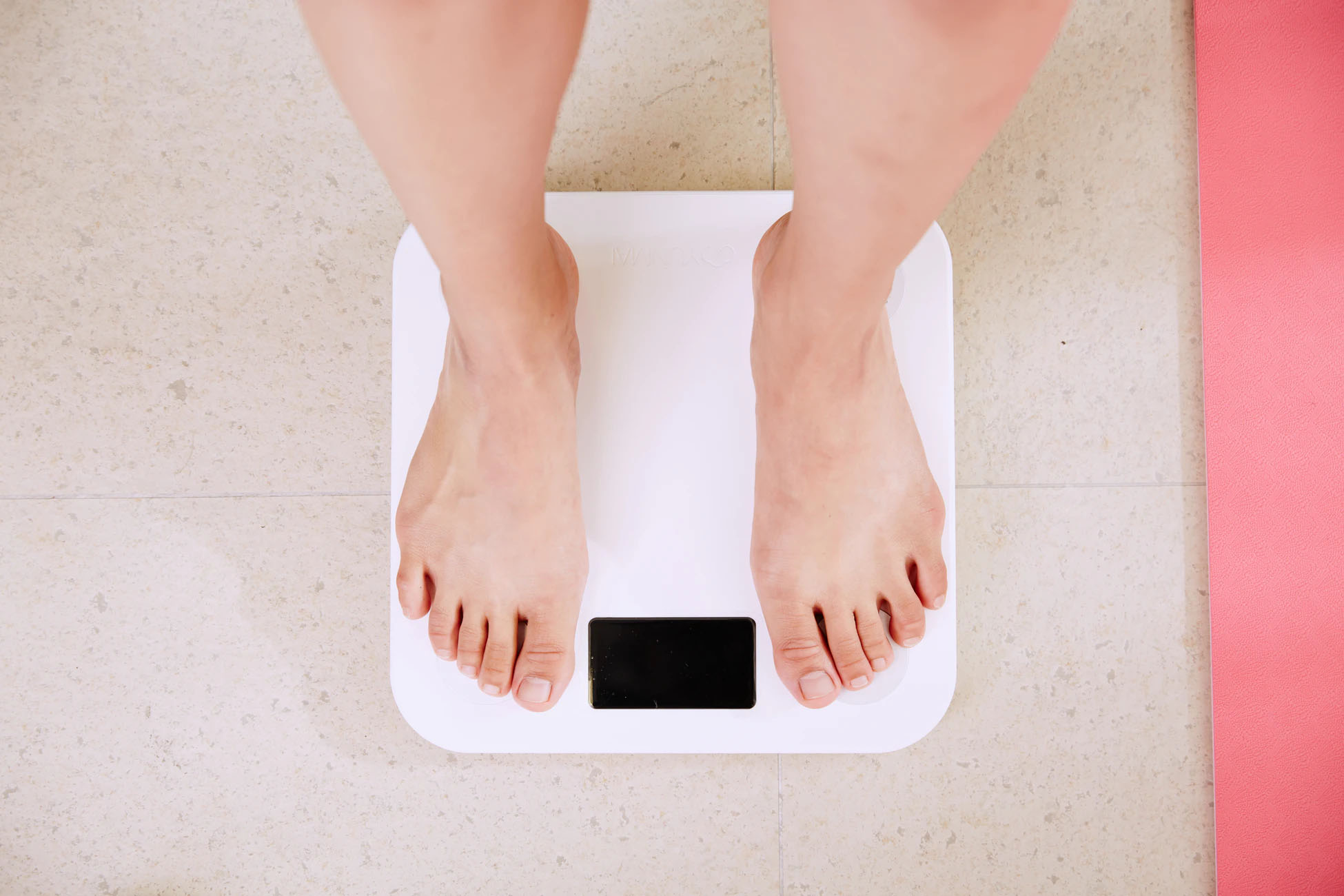 Someone standing on a weight scale