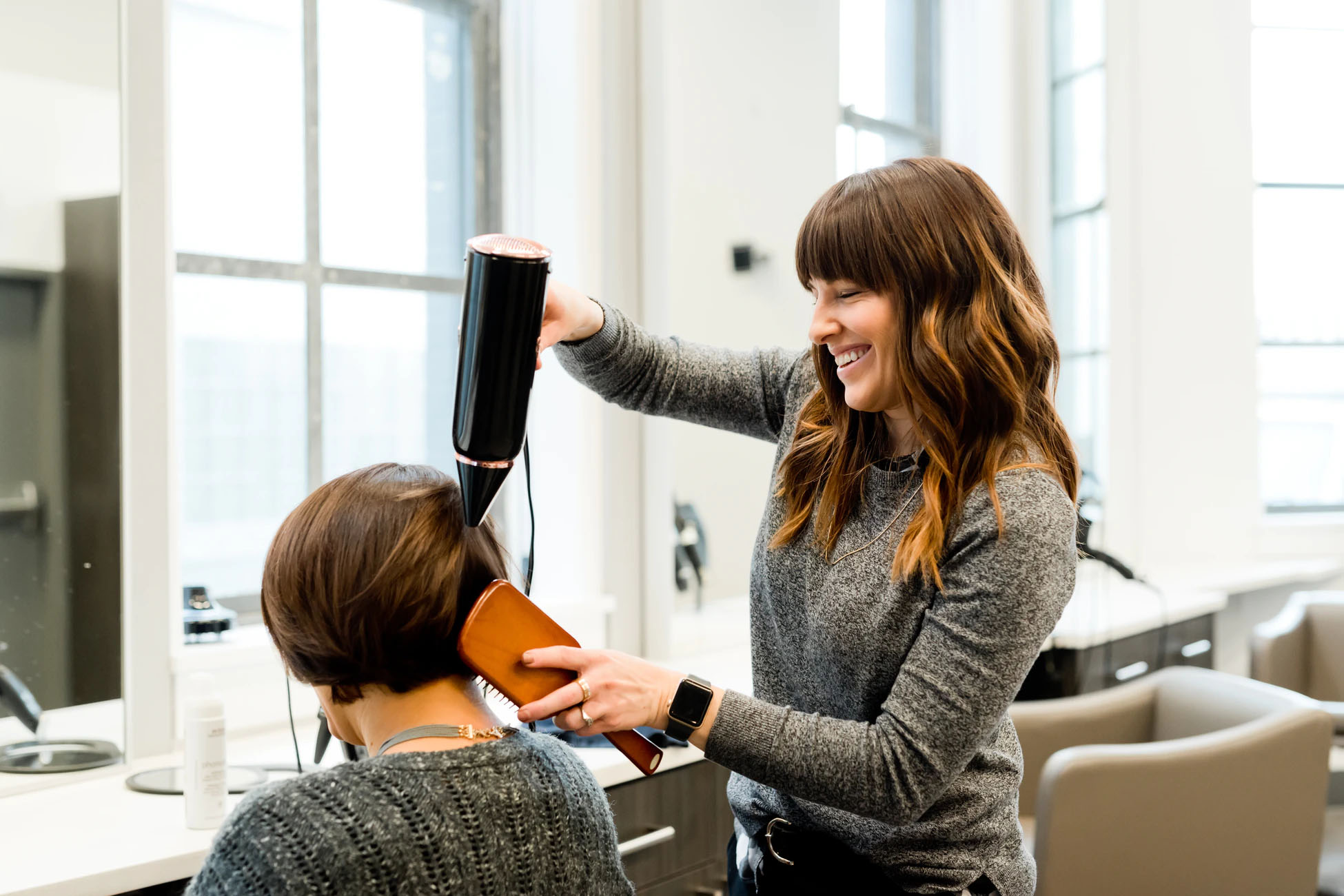 Hairdresser serving a customer