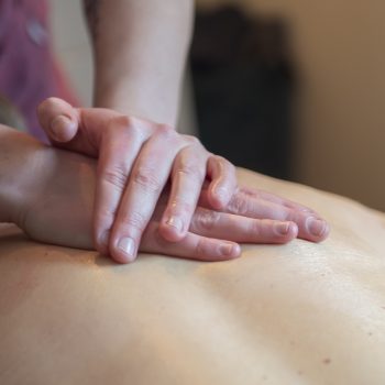 Close-up of muscle therapist and clinic owner Veronica Warhaug providing a treatment to a patient