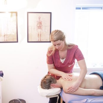 Muscle therapist and clinic owner Veronica Warhaug providing a treatment to a patient