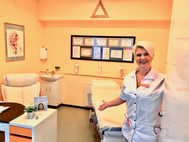 Clinic owner and therapist Hilde Sylstad standing in her treatment room