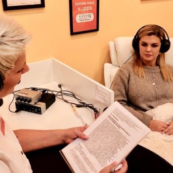 Clinic owner and therapist Hilde Sylstad providing treatment to a patient in her treatment room