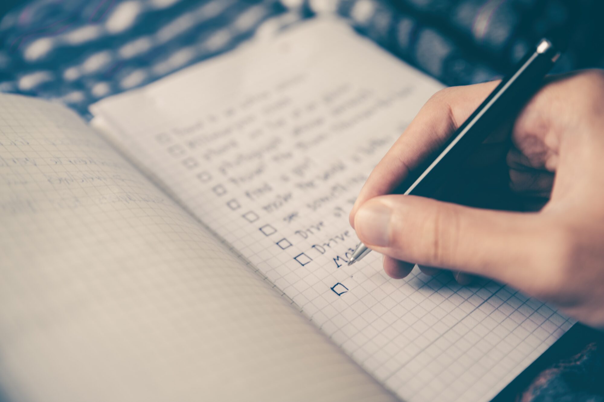 a person writing in a notebook