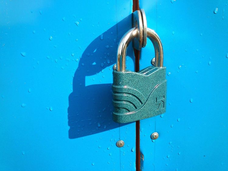 A lock on a blue door