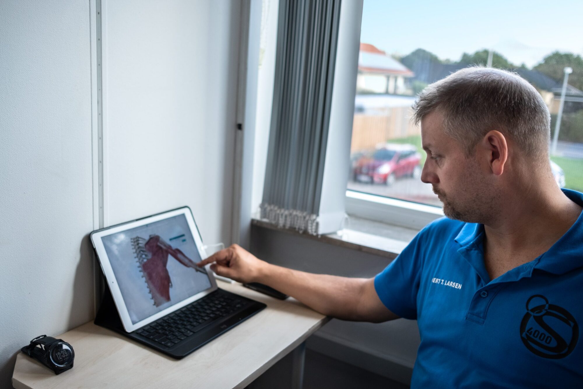 Physiotherapist & sports medicine expert Gitte Vestergaard standing in front of her practice