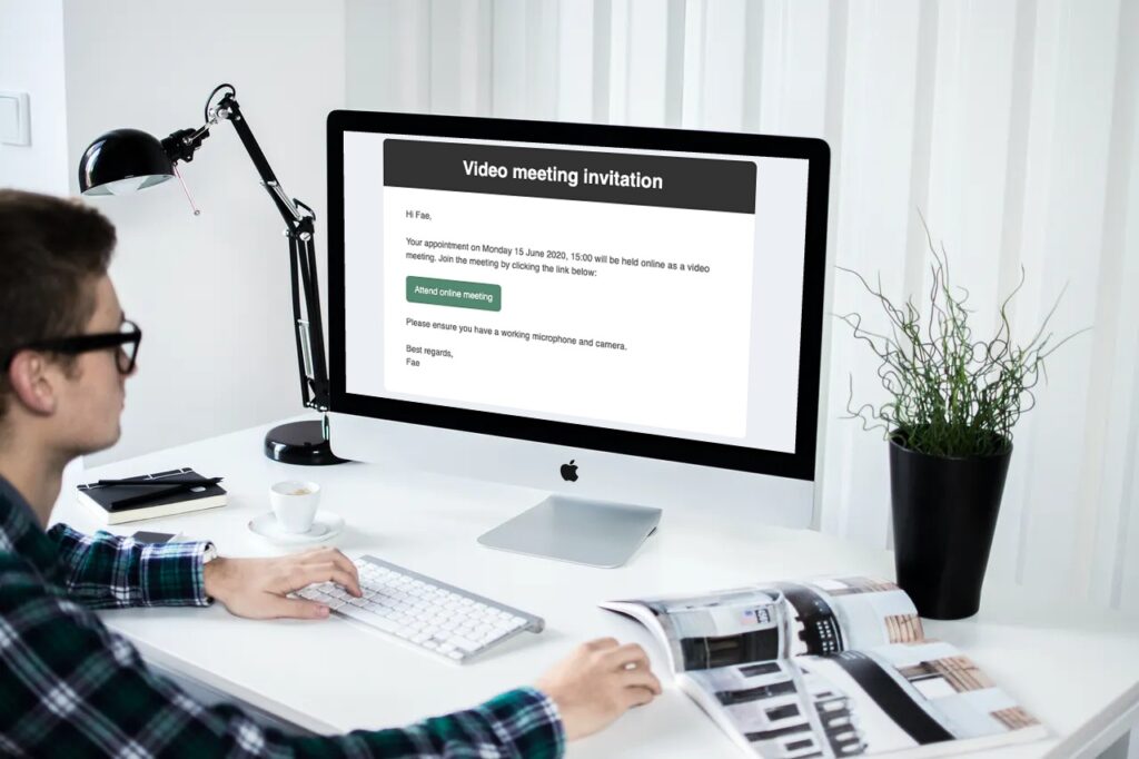 Man receiving a video meeting invitation by email