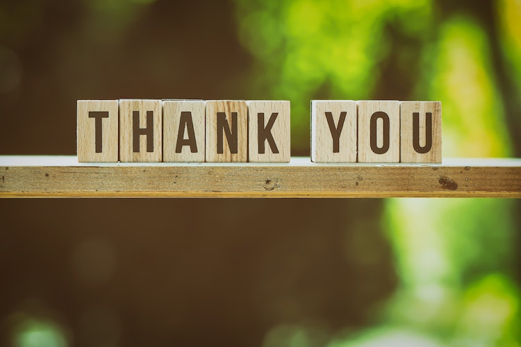 Wooden cubes displaying the words 'Thank you'