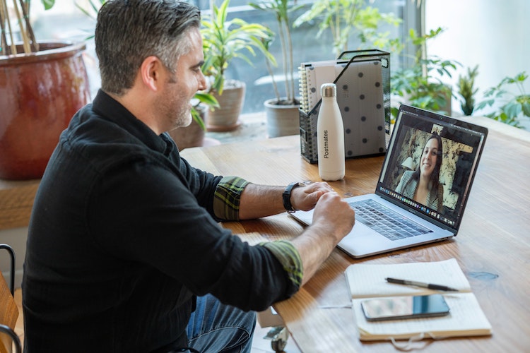 A man holding a online meeting.