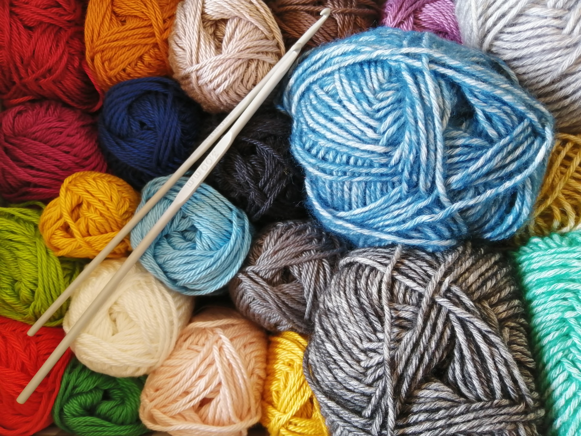 several colorful balls of wool yarn