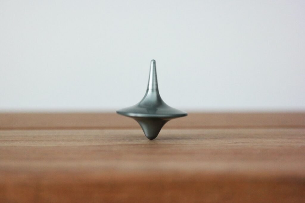 Spinning top on a wooden table