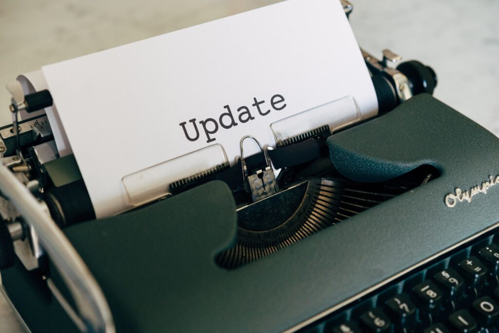 typewriter with a paper saying "Update"