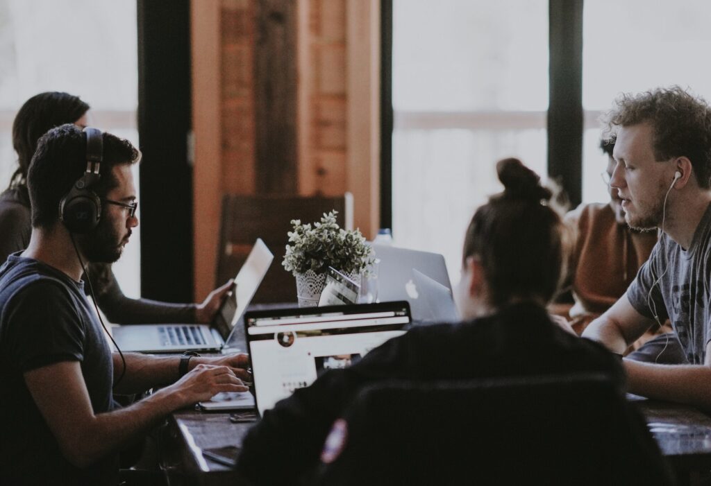 Employees sitting around a table discussing